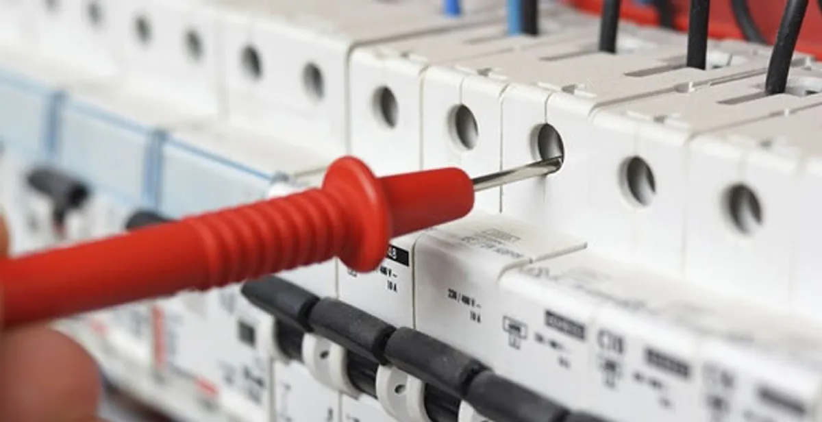 Electrical contractor testing circuit breakers during electrical repair in Sachse, TX