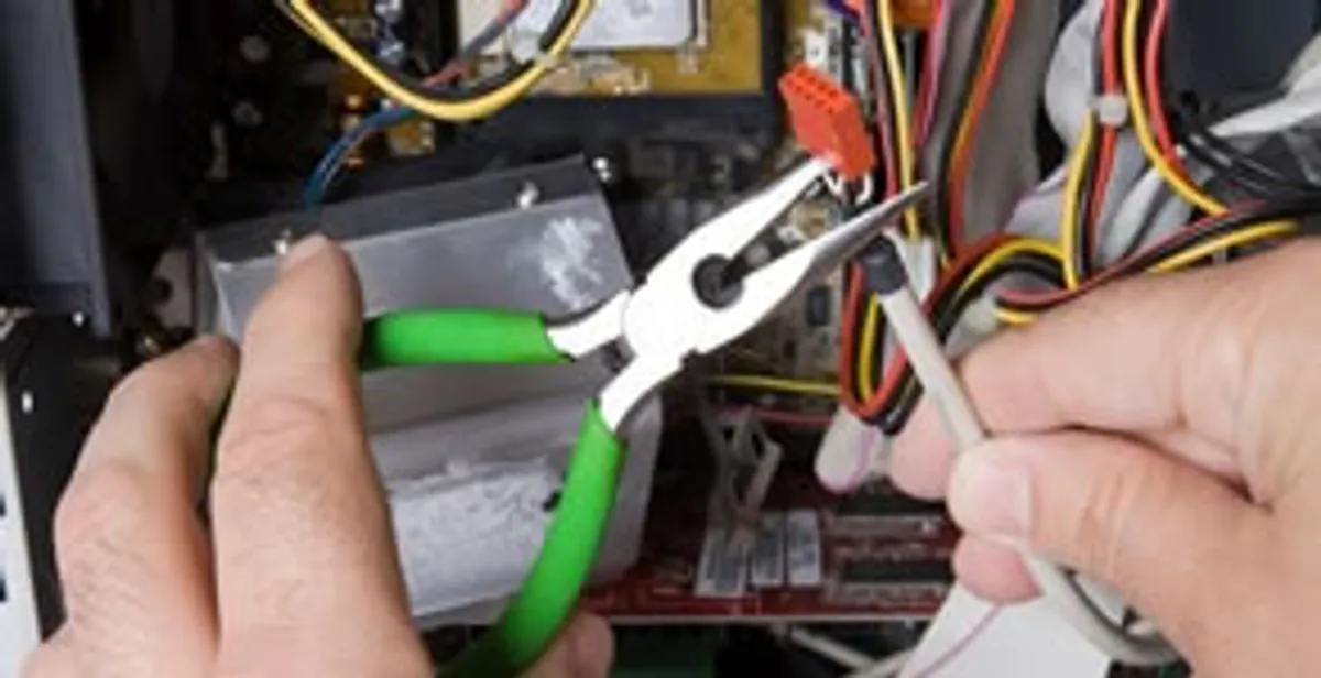 Licensed electrical contractor performing electrical repair with tools in Hutchins, TX